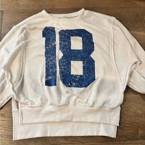 White Sweatshirt with Blue '18' Graphic